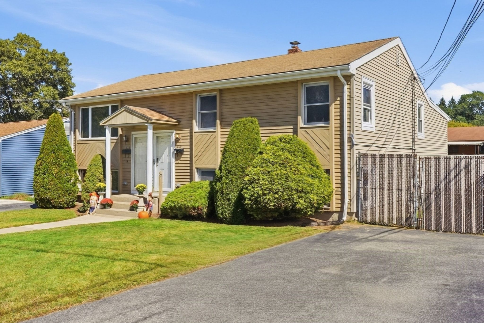 Front exterior and driveway of the sold two-family home