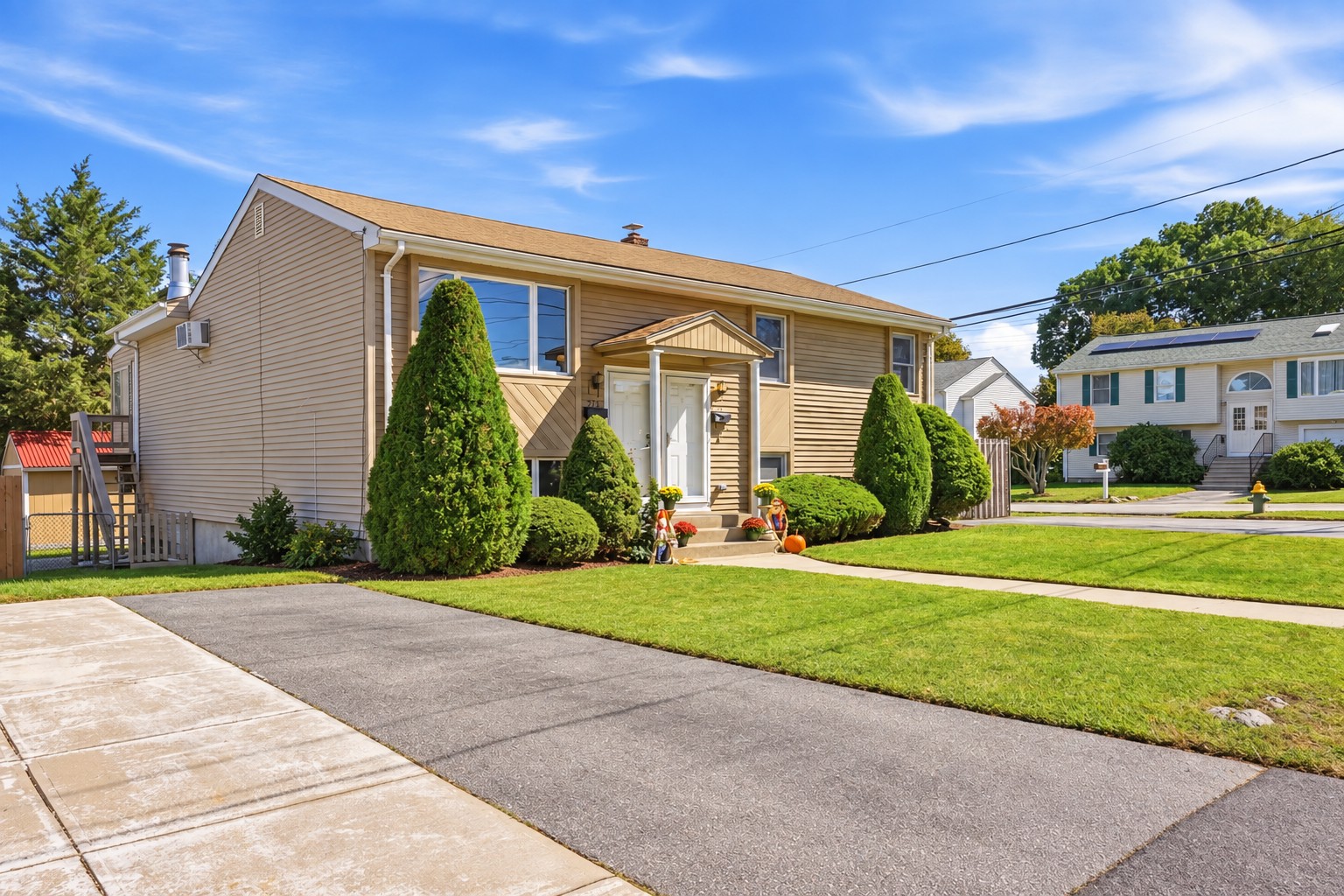 Front of the sold North Providence two-family home on a sunny day